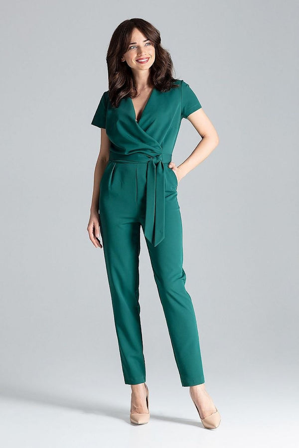 Short-sleeved jumpsuit with loose drape at the waist, tie belt, and long trousers, ideal for a stylish city look.