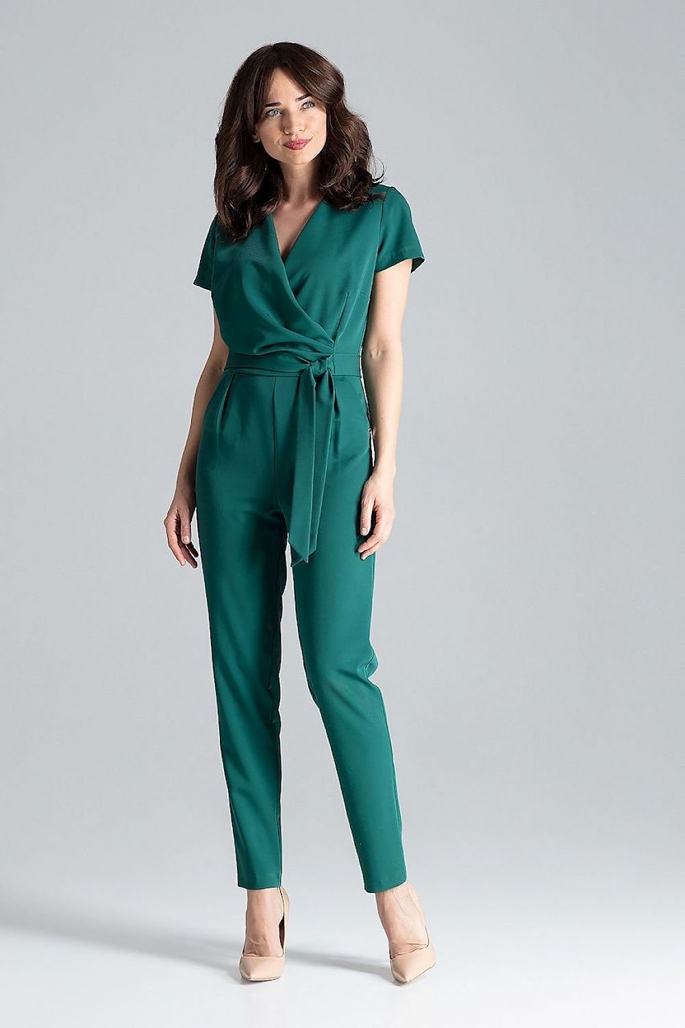 Short-sleeved jumpsuit with loose drape at the waist, tie belt, and long trousers, ideal for a stylish city look.