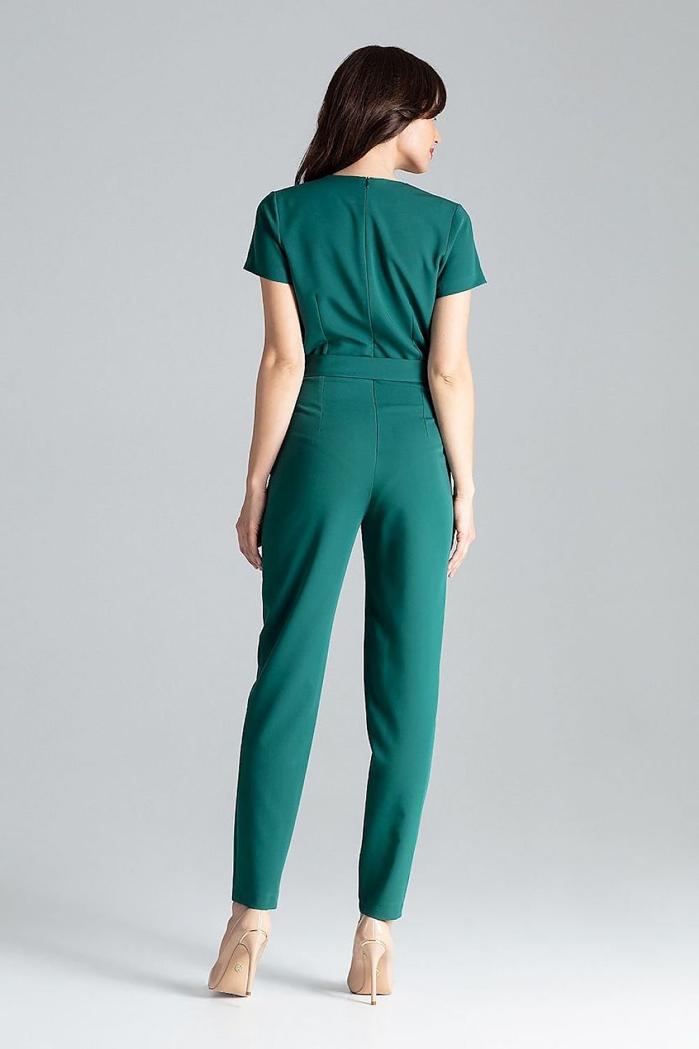 Short-sleeved jumpsuit with loose drape at the waist, tie belt, and long trousers, ideal for a stylish city look.