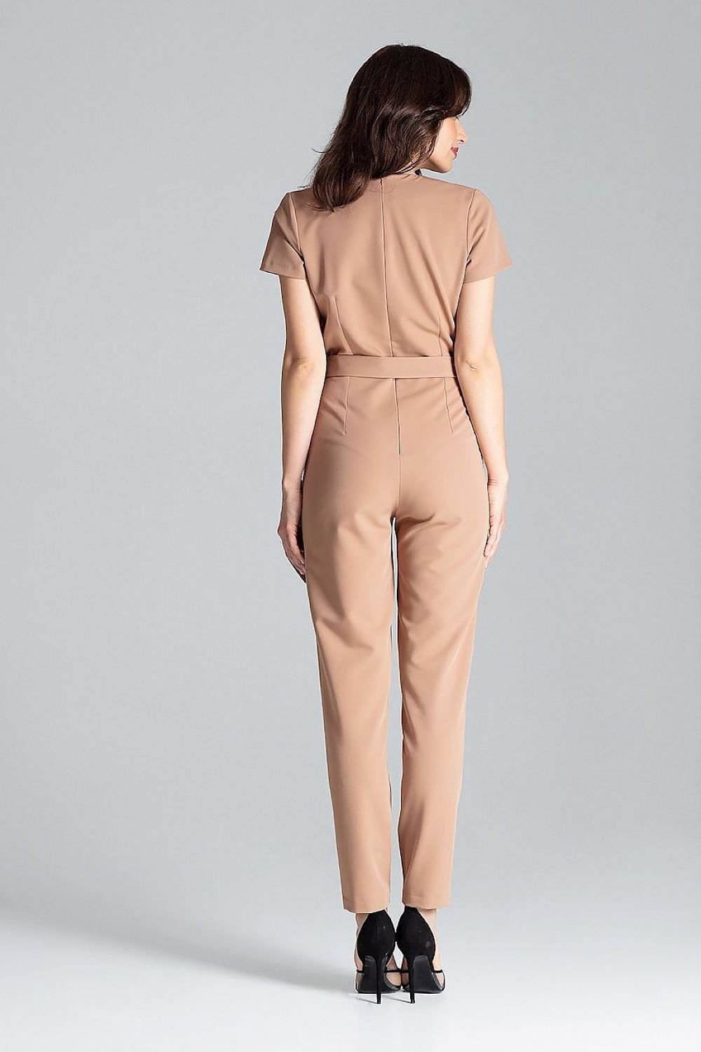 Short-sleeved jumpsuit with loose drape at the waist, tie belt, and long trousers, ideal for a stylish city look.