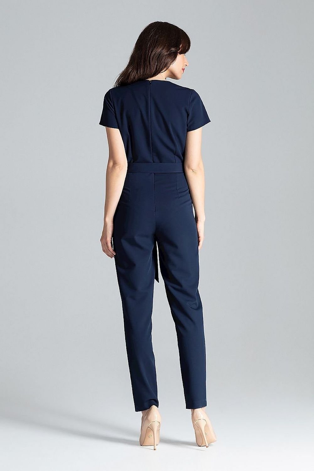 Short-sleeved jumpsuit with loose drape at the waist, tie belt, and long trousers, ideal for a stylish city look.