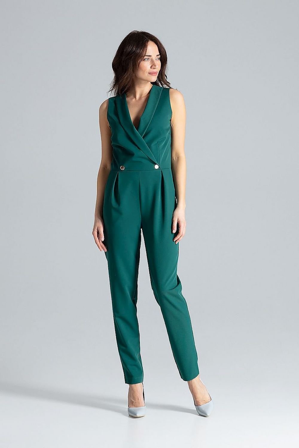 Classic sleeveless jumpsuit with lined narrow lapels, envelope neckline, decorative silver-colored metal snap fasteners, and slanted side pockets.