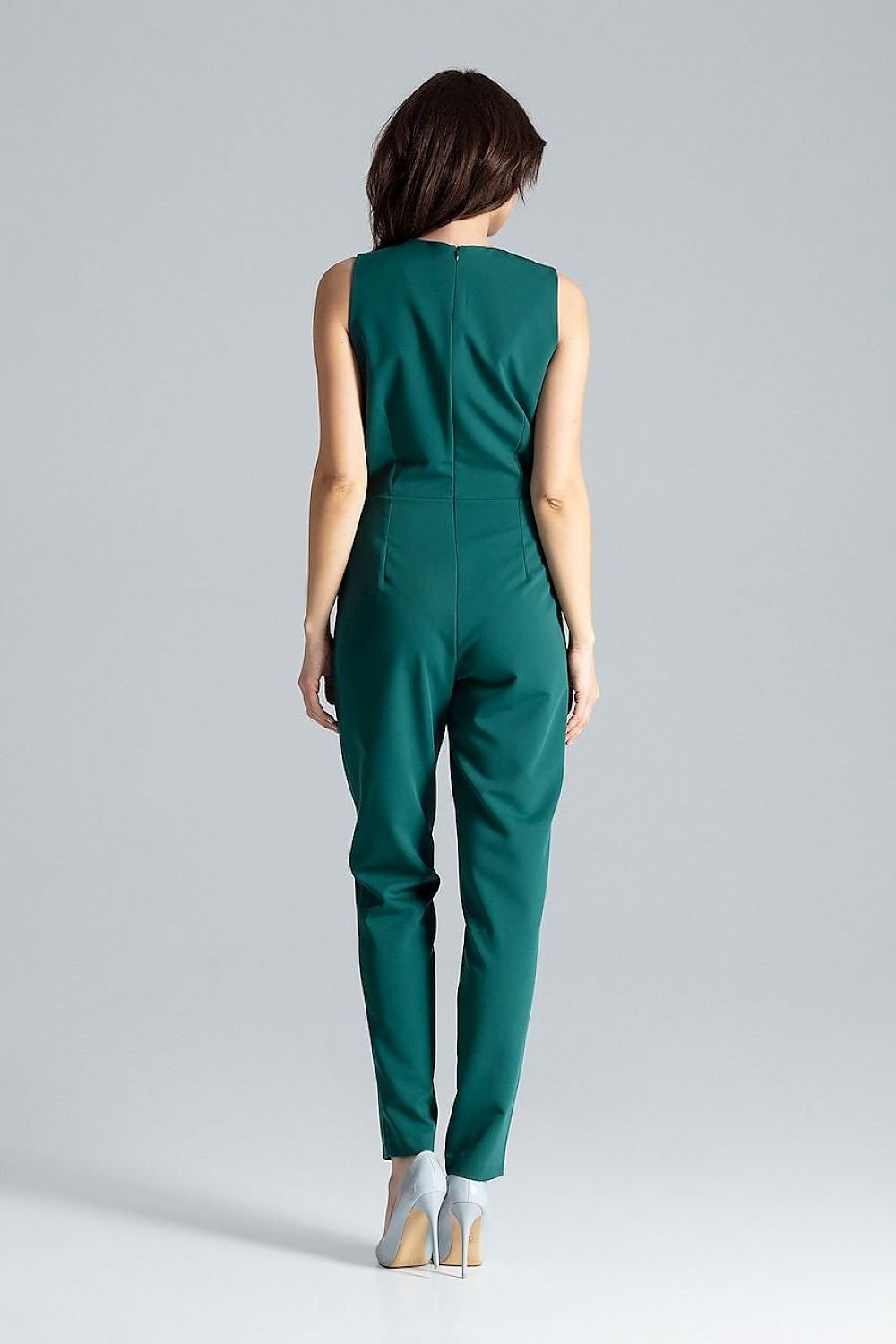 Classic sleeveless jumpsuit with lined narrow lapels, envelope neckline, decorative silver-colored metal snap fasteners, and slanted side pockets.