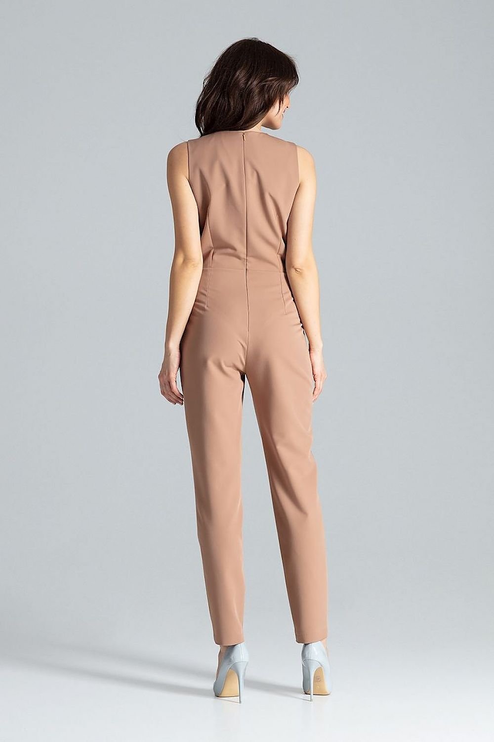 Classic sleeveless jumpsuit with lined narrow lapels, envelope neckline, decorative silver-colored metal snap fasteners, and slanted side pockets.