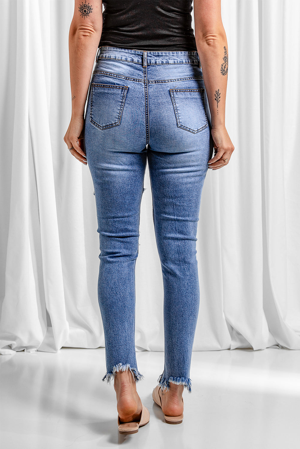 Distressed Raw Hem Skinny Jeans - SHIRLYN.CO